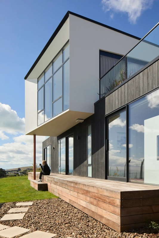 <img alt="Outdoor deck at Haumoko House — sheltered balcony with estuary and coastal range views, Site Architecture Clifton Christchurch." src="/images/2/5/1/0/2/251029lmhl043-c0a6204f.webp?description" width="1536" height="2048" />