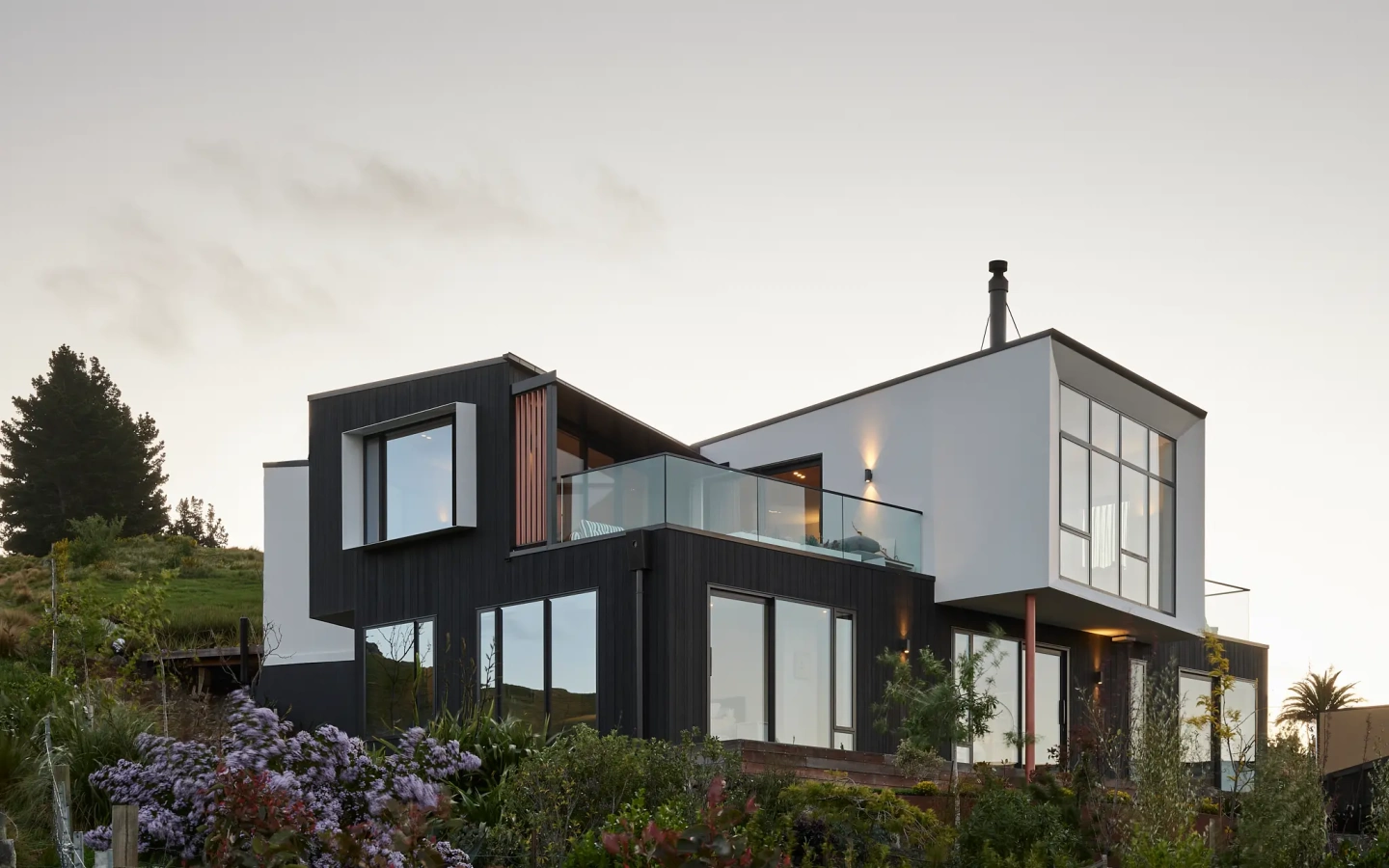 <img alt="Haumoko House by Site Architecture. Two offset dark-clad volumes on Clifton hillside with timber plinth, Christchurch residential architecture." src="/images/2/5/1/0/2/251029lmhl066-3ee4edb5.webp?description" width="2048" height="1536" /> fetchpriority=