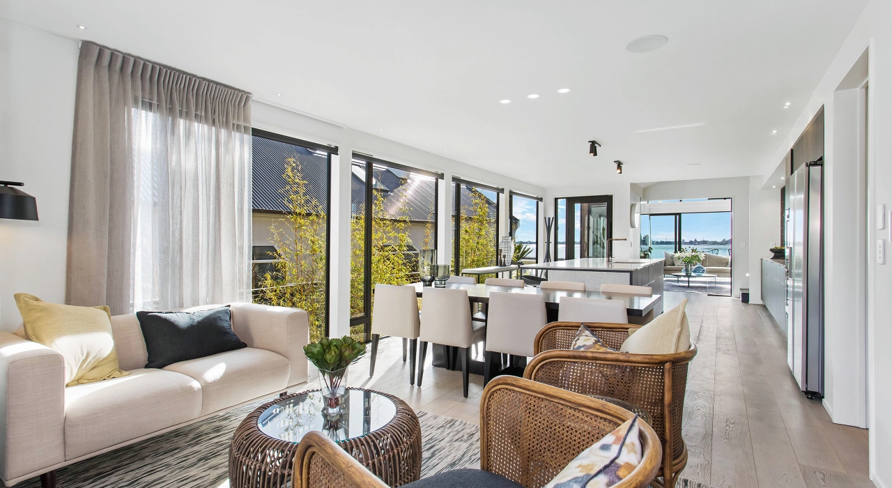 <img alt="Relaxed living and dining area with natural linen furnishings, large windows drawing in soft coastal light." src="/images/d/o/n/-/r/don-roy-site-architecture-moncks-bay-dining-lounge-5136882d.webp?description" width="2560" height="1706" />