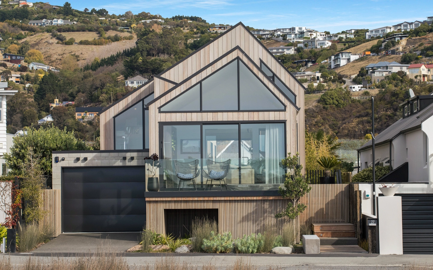 <img alt="Beachville by Site Architecture, oiled cedar cladding and asymmetrical roofline set against the red cliffs of Te Raekura Christchurch." src="/images/d/o/n/-/r/don-roy-site-architecture-moncks-bay-street-front-on-daytime-4283a9f2.webp?description" width="2560" height="1707" /> fetchpriority=