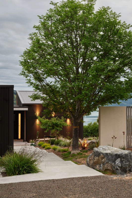 <img alt="Entry path at Akaroa Pentref, lush landscaping leading to dark-clad residential buildings, Site Architecture Christchurch." src="/images/e/n/t/r/y/entry-path-akaroa-pentref-site-architecture-srp-93852b7d.webp?description" width="3000" height="4000" />