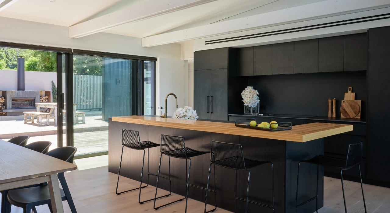 <img alt="Kitchen interior at Akaroa Pentref with dark clad cabinetry, timber bench-top, open plan living, Site Architecture Christchurch." src="/images/i/n/t/e/r/interior-kitchen-akaroa-pentref-site-architecture-srp-96256fbb.webp?description" width="4000" height="3000" />