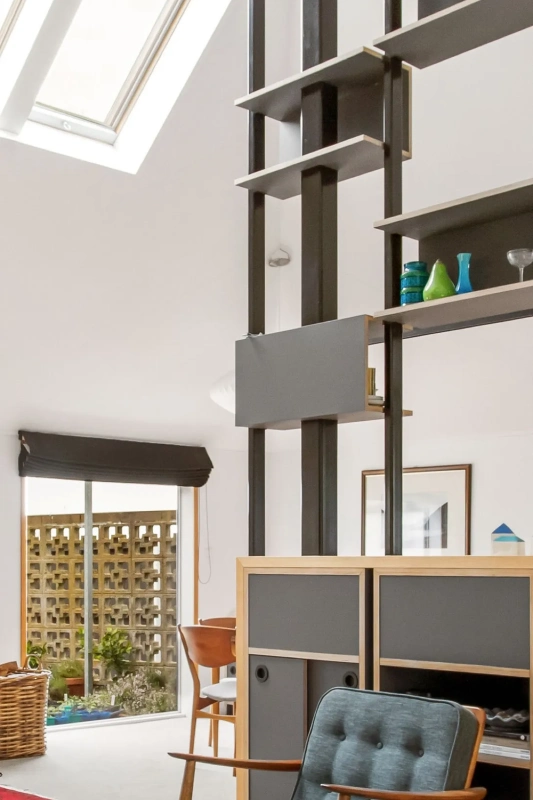 <img alt="Architectural detail of powder coated steel shelf brackets and timber shelving, new joinery aligned with existing window and courtyard views." src="/images/s/i/t/e/-/site-arch-paulus-tce2-d043f3cc.webp?description" width="1090" height="2560" />