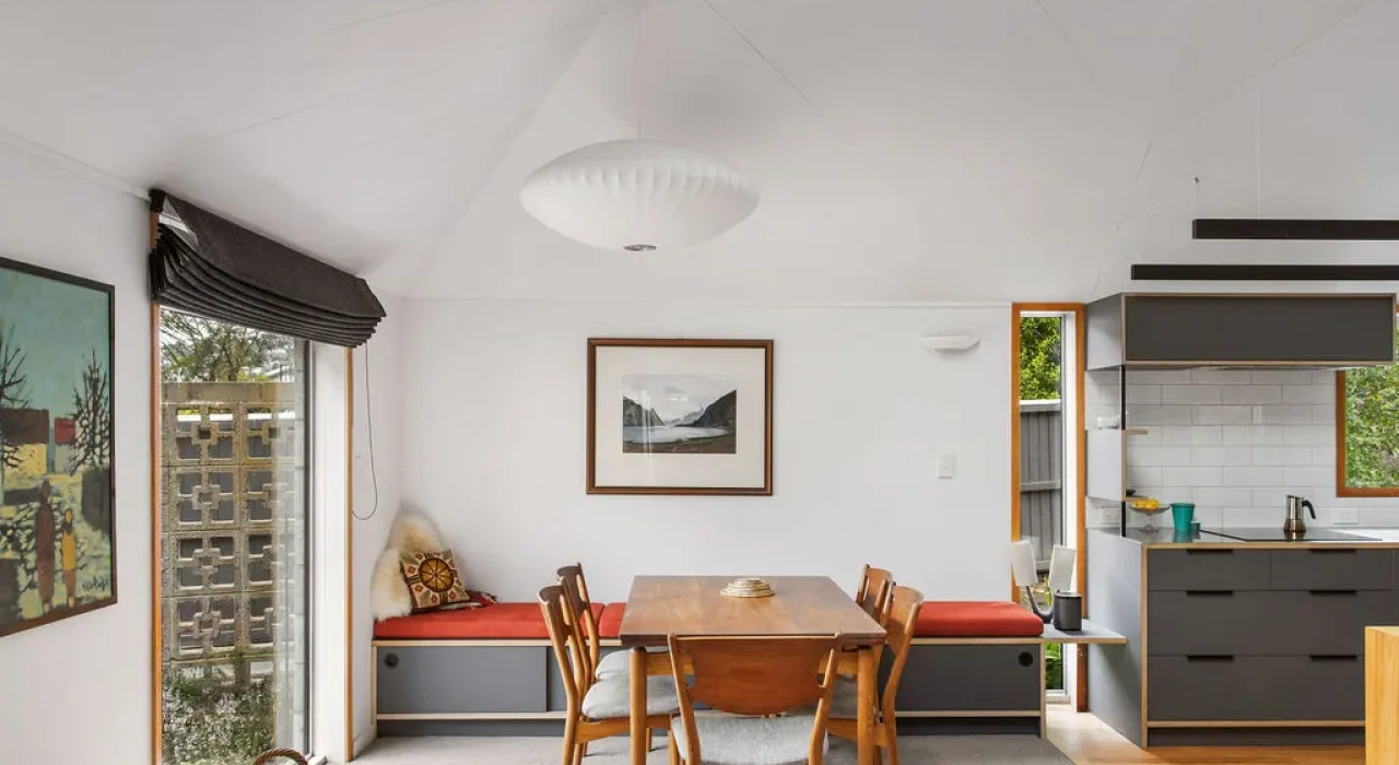 <img alt="Dining and kitchen area with timber joinery, mid-century chairs and natural light from garden-facing windows." src="/images/s/i/t/e/-/site-arch-paulus-tce3-274bd4de.webp?description" width="1024" height="683" />