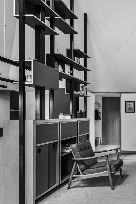 <img alt="Black and white detail of timber and steel shelving with framed artwork, refined joinery complementing the original architecture." src="/images/s/i/t/e/-/site-arch-paulus-tce5-f21fd53d.webp?description" width="1581" height="2560" />
