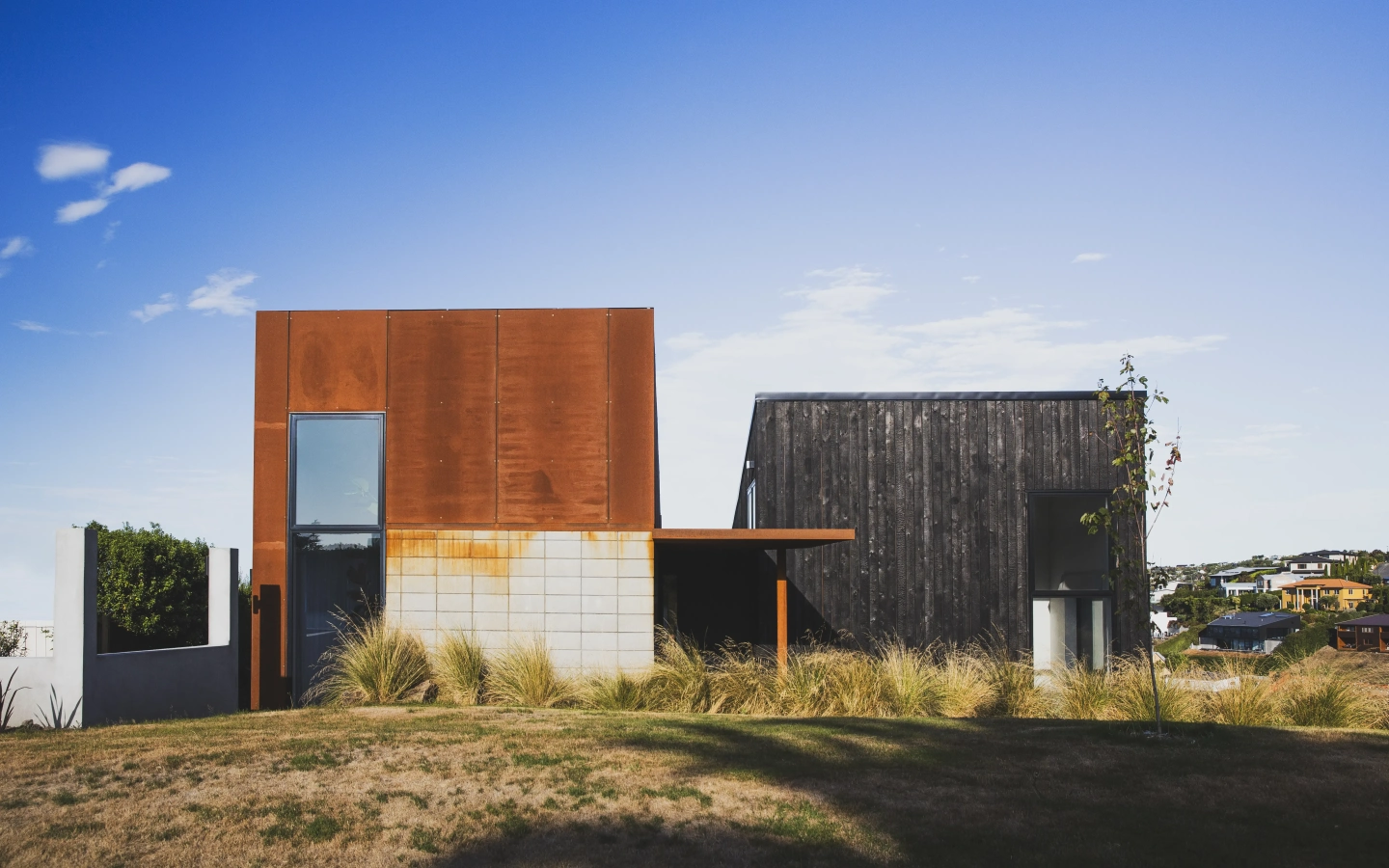 <img alt="Drayton by Site Architecture, corten steel and charred larch volumes on the hillcrest at Mt Pleasant, Christchurch" src="/images/s/i/t/e/-/site-architecture-drayton-drive1-28c66688.webp?description" width="4950" height="3300" /> fetchpriority=