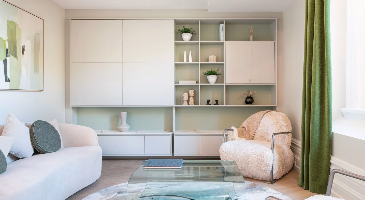 <img alt="Light-filled sitting room with soft furnishings, sage green shelving and generous glazing connecting to city views." src="/images/s/i/t/e/-/site-architecture-suite-17-ogb-interior-architecture10-fbeb2e41.webp" width="2560" height="1707" />